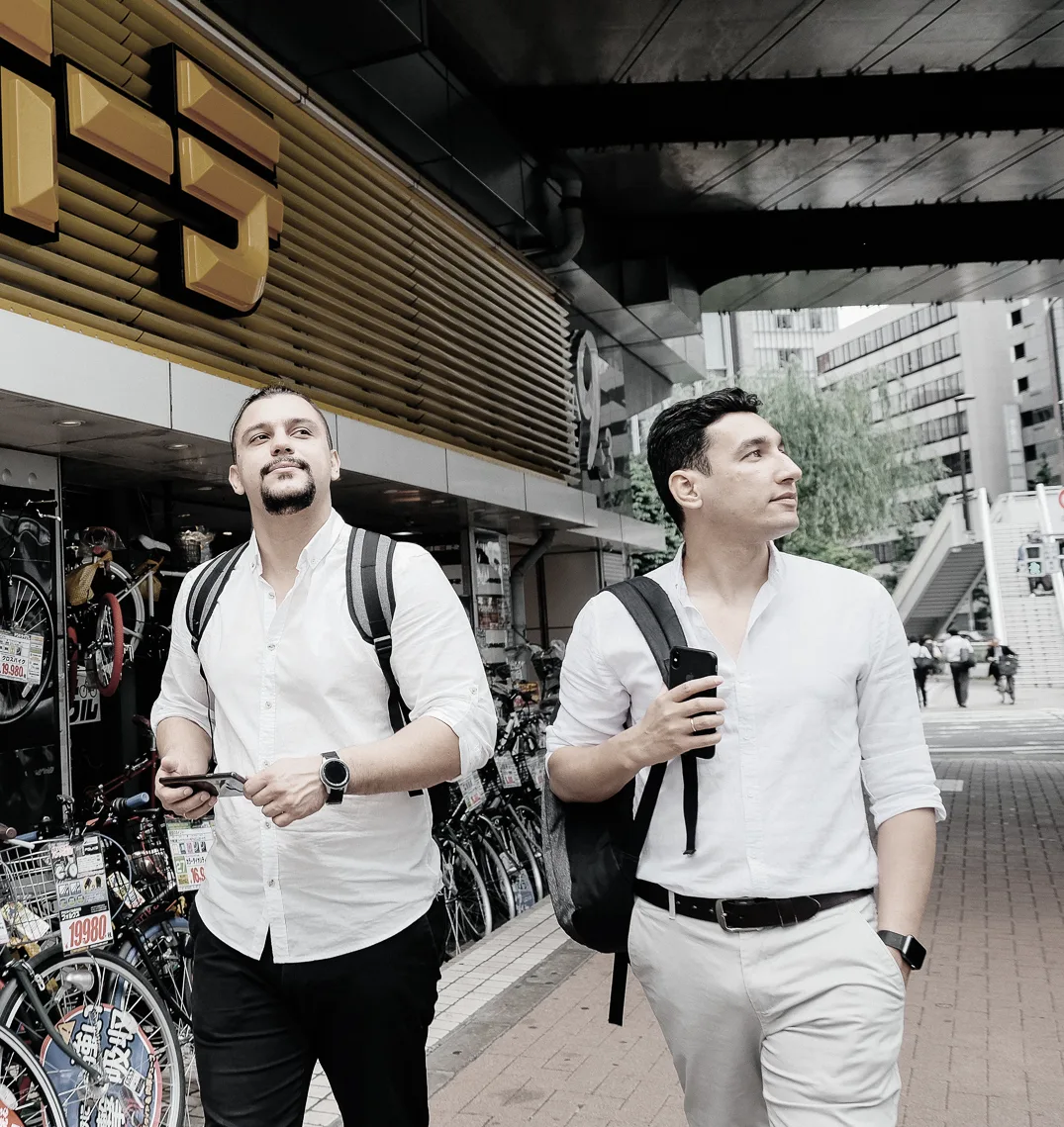 Maxim Oltyan and Davron Talipov on a street in Japan during a work trip